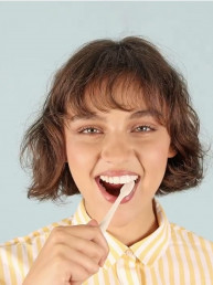 girl with white teeth brushing